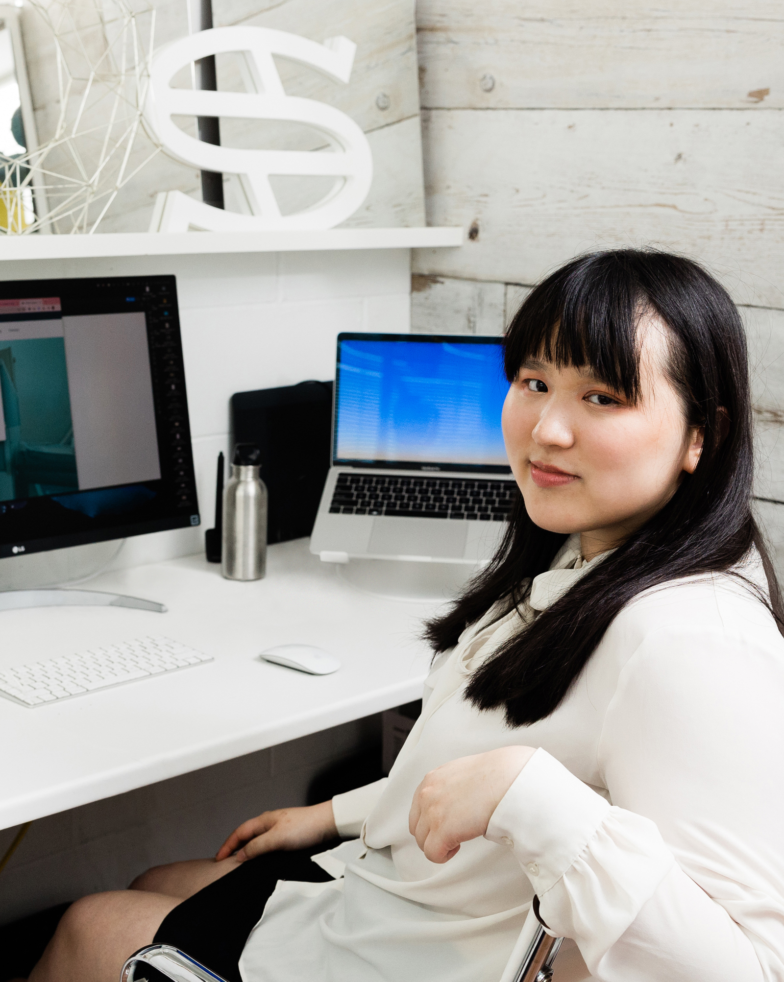 Rebecca at Steady Studio at her desk. | Photo By: Mateus Studios